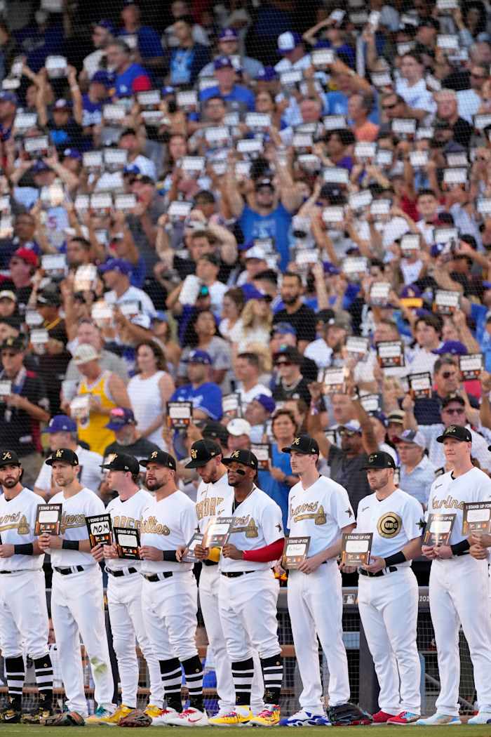 National League players stand up to cancer.